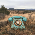 Broken turquoise rotary phone in new mexico